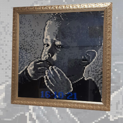 Ingelijste Lego-bouwwerk met foto